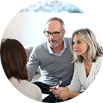 A couple is having a conversation with a third person.